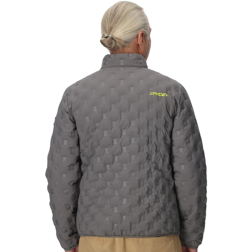 Person wearing a gray quilted jacket with a brand logo on the back, standing against a white background.