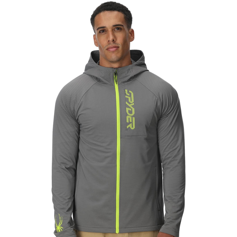 Man wearing a gray jacket with a green zipper and 'Spyder' branding on a white background