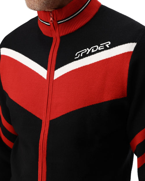 Man wearing a black and red jacket with Spyder logo on a white background