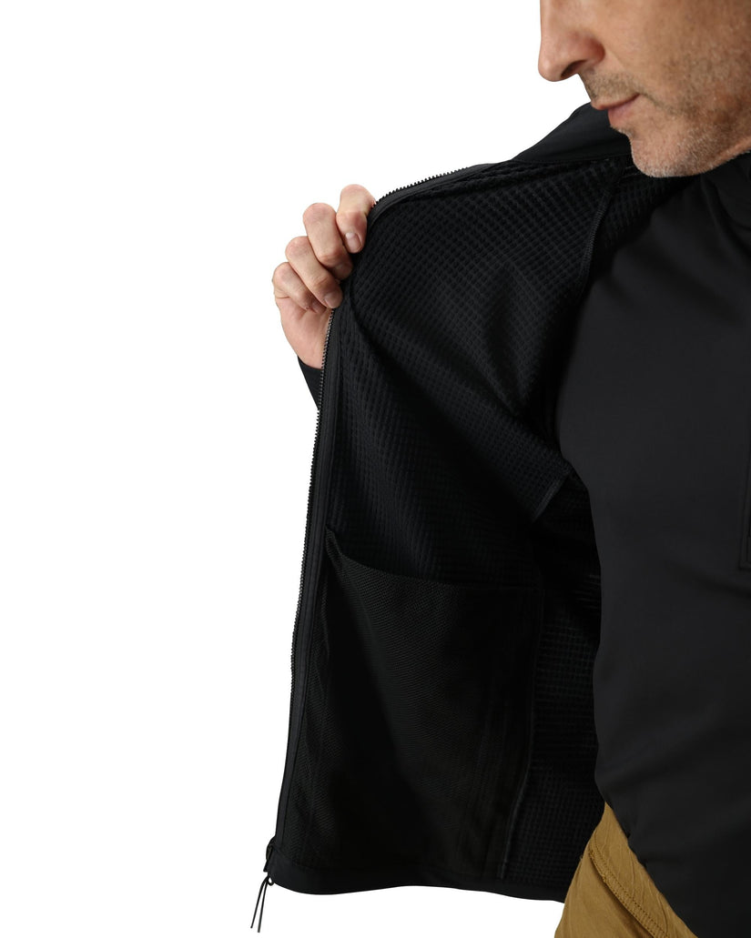 Person wearing a black jacket with a white background