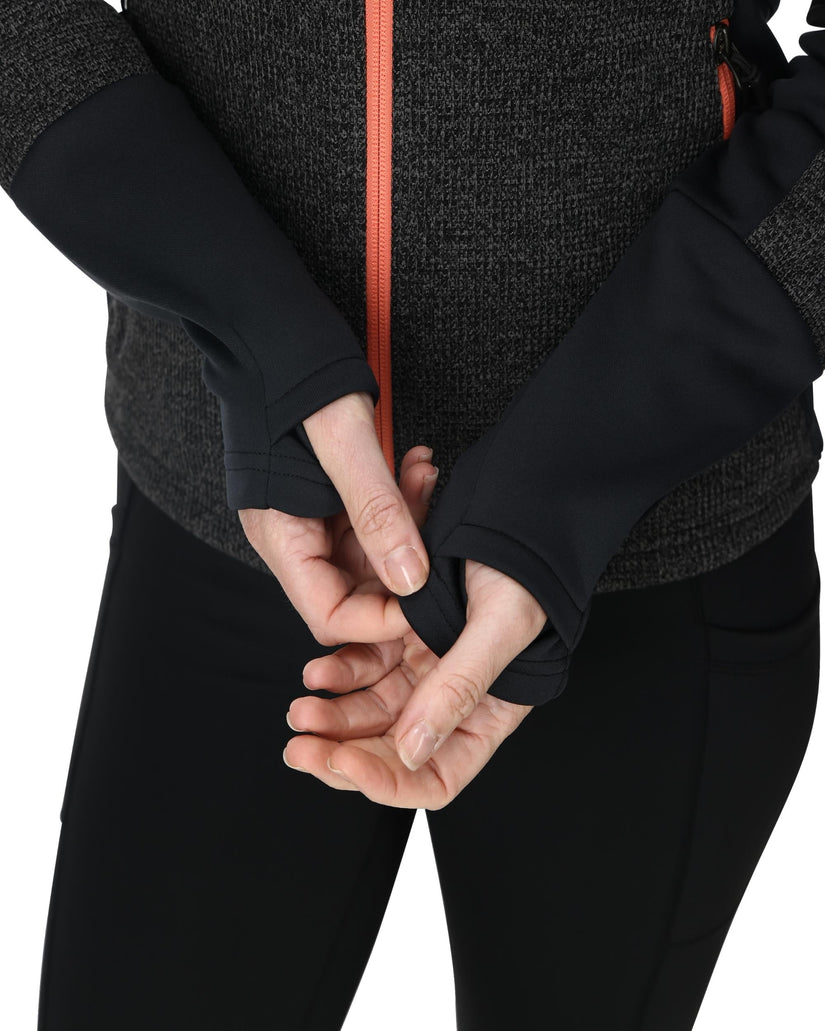Person wearing black gloves on a white background