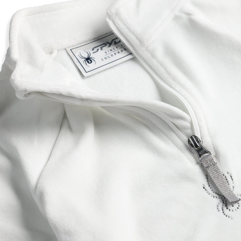 Close up of fleece quarter zip with sparkle spyder logo.