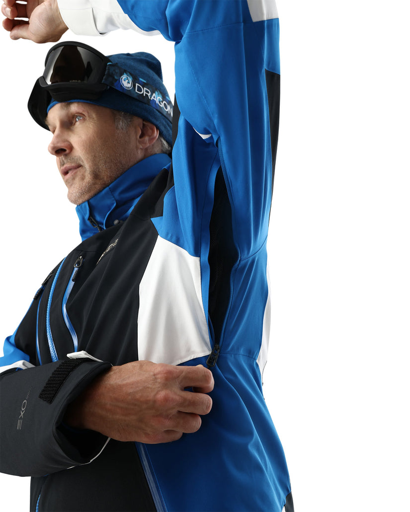 Person wearing a blue and black jacket with a white background