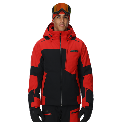 Person wearing a red and black ski jacket with goggles on a white background