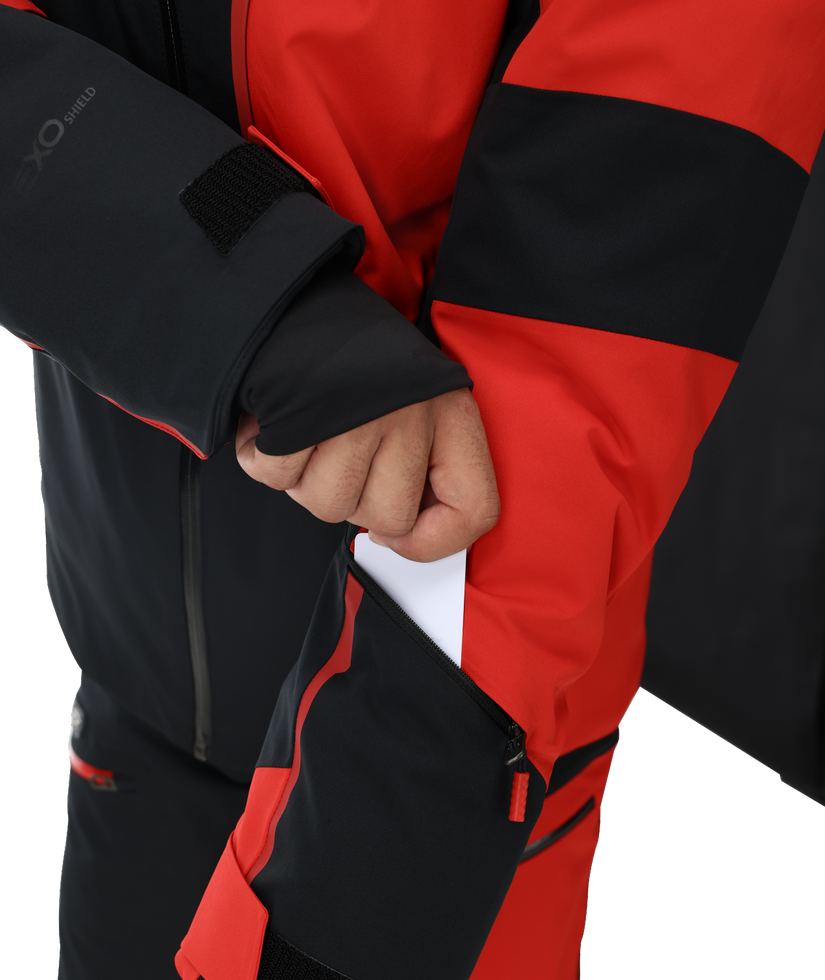 Close-up of a person wearing a black and red jacket with a visible brand logo.
