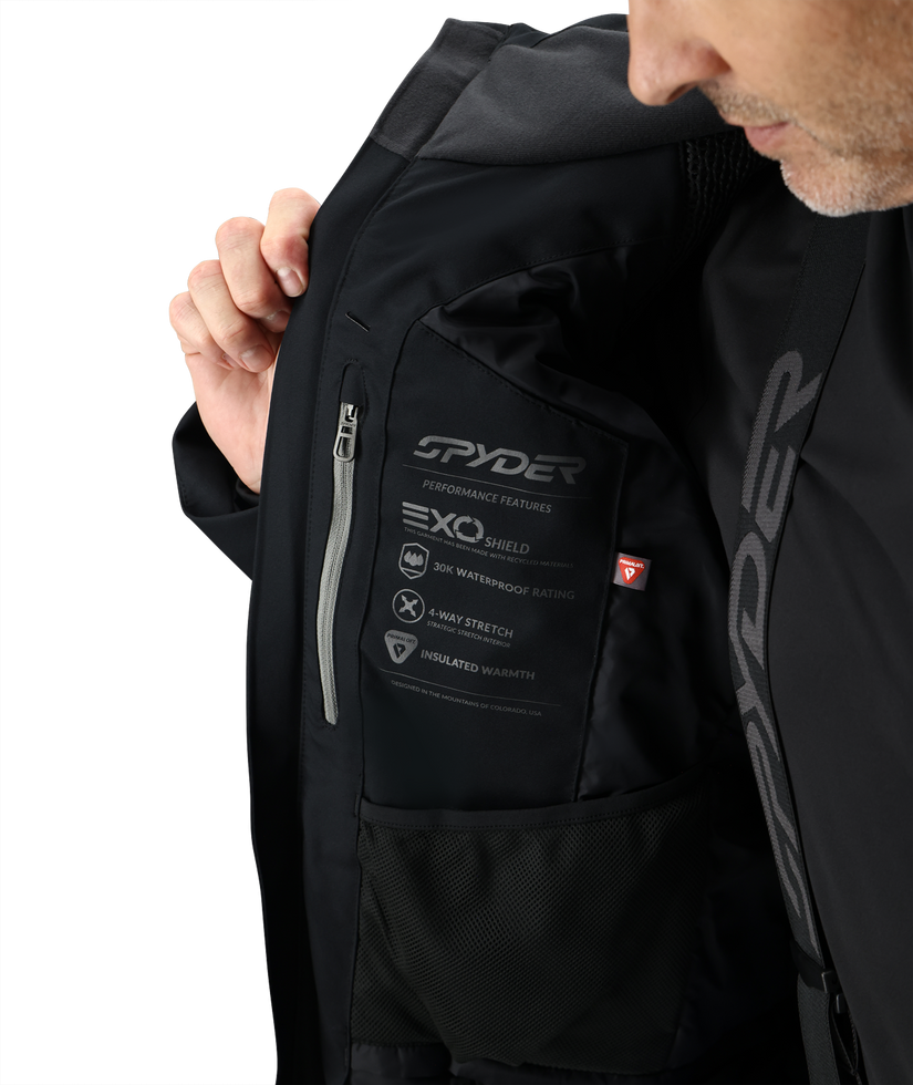 Black Spyder jacket with visible branding and features on a white background