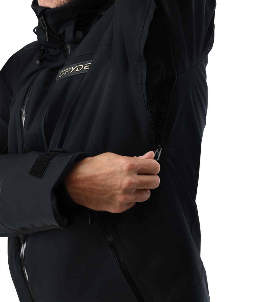 Close-up of a person wearing a black jacket with a brand logo on a white background