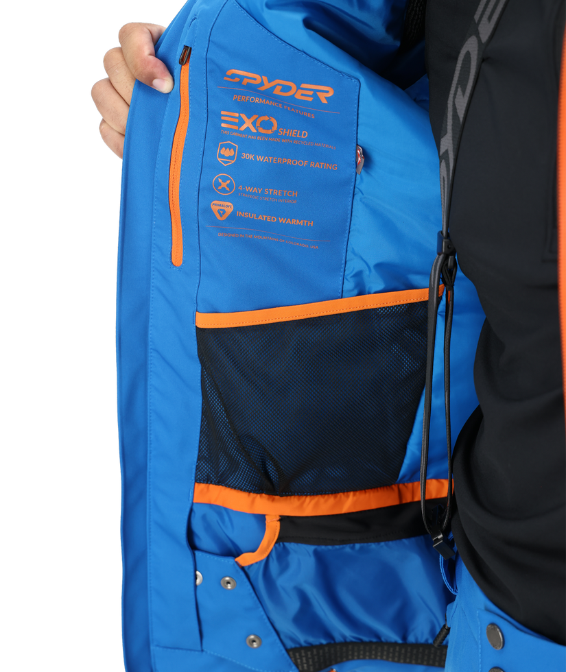 Blue ski bag with orange accents and Spyder branding on a white background