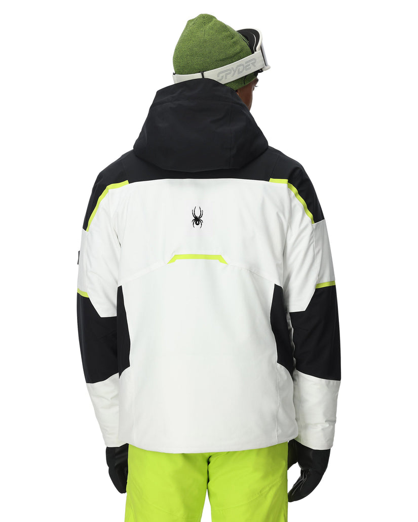 Person wearing a black, white, and green jacket with a visible brand logo on a white background