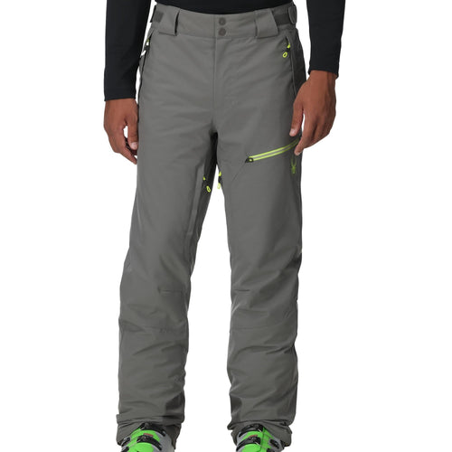Gray pants with green accents worn by a person on a white background