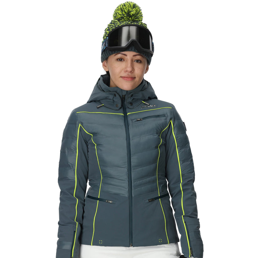 Person wearing a gray ski jacket with green accents on a white background