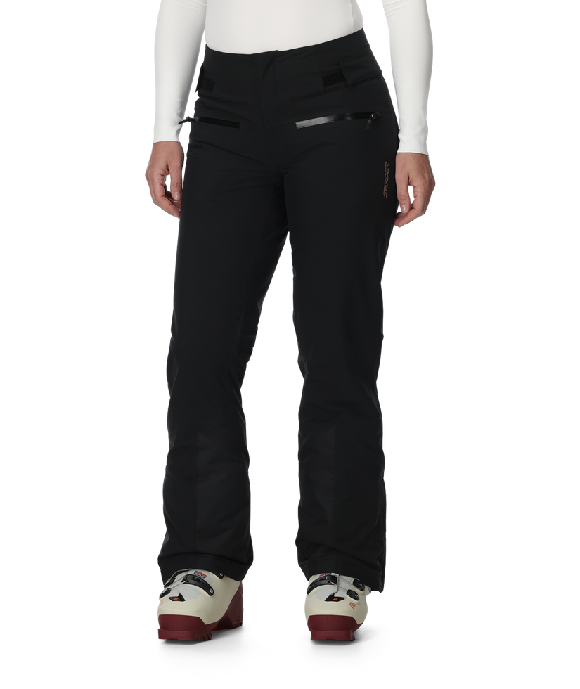 Black pants worn by a person on a white background