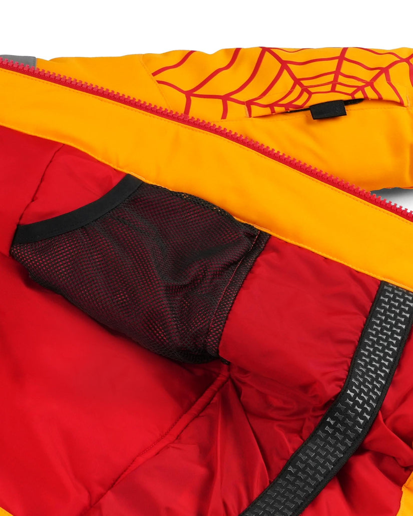 Close-up of a red and yellow jacket with a spider web design on the hood.
