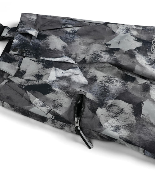 Camouflage-patterned bib overalls with suspenders on a white background