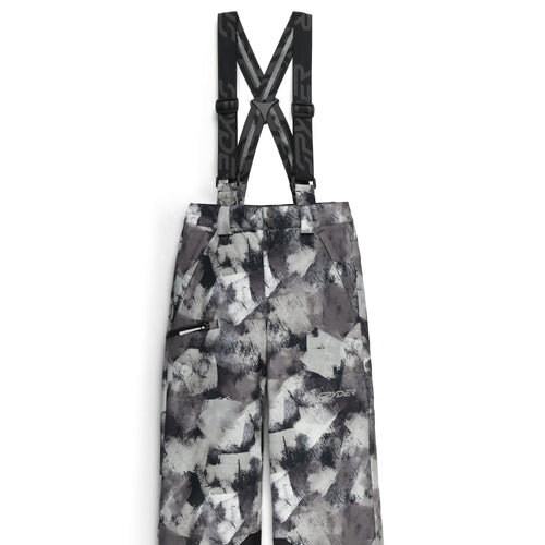 Camouflage-patterned bib overalls with suspenders on a white background