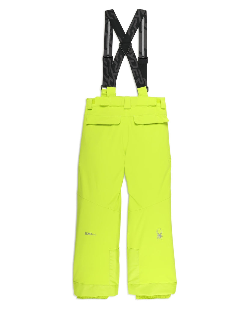 Bright yellow ski pants with black suspenders on a white background