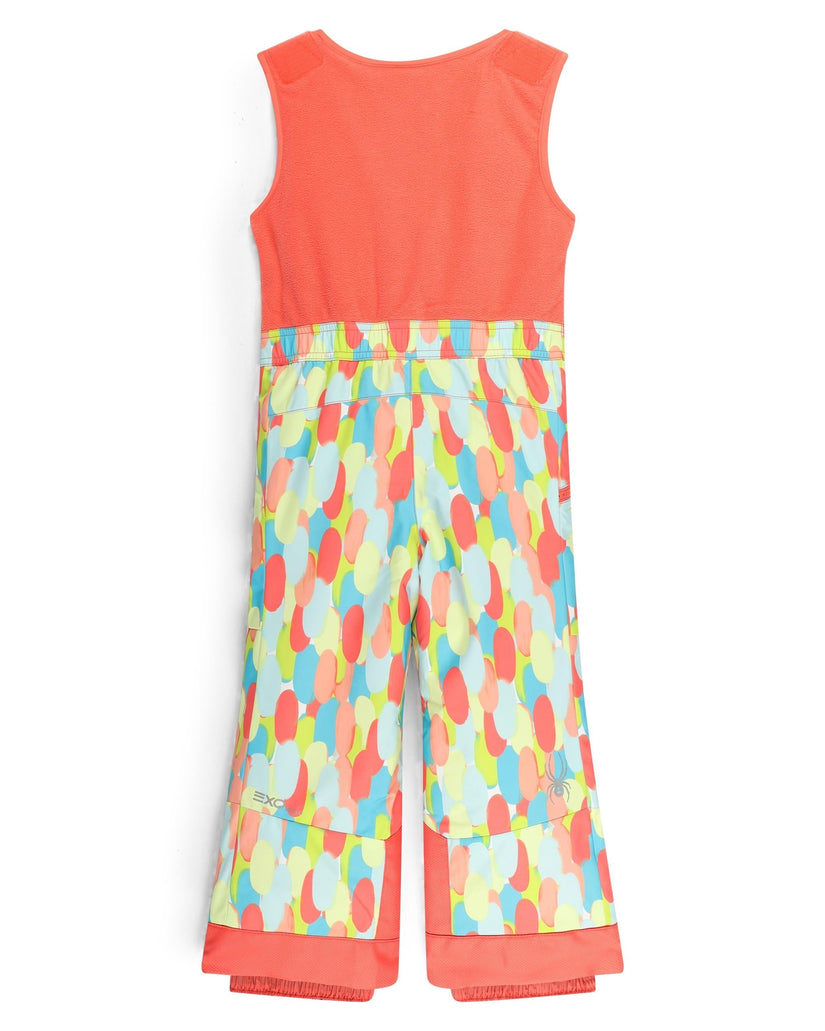 Colorful sleeveless top and patterned pants on a white background