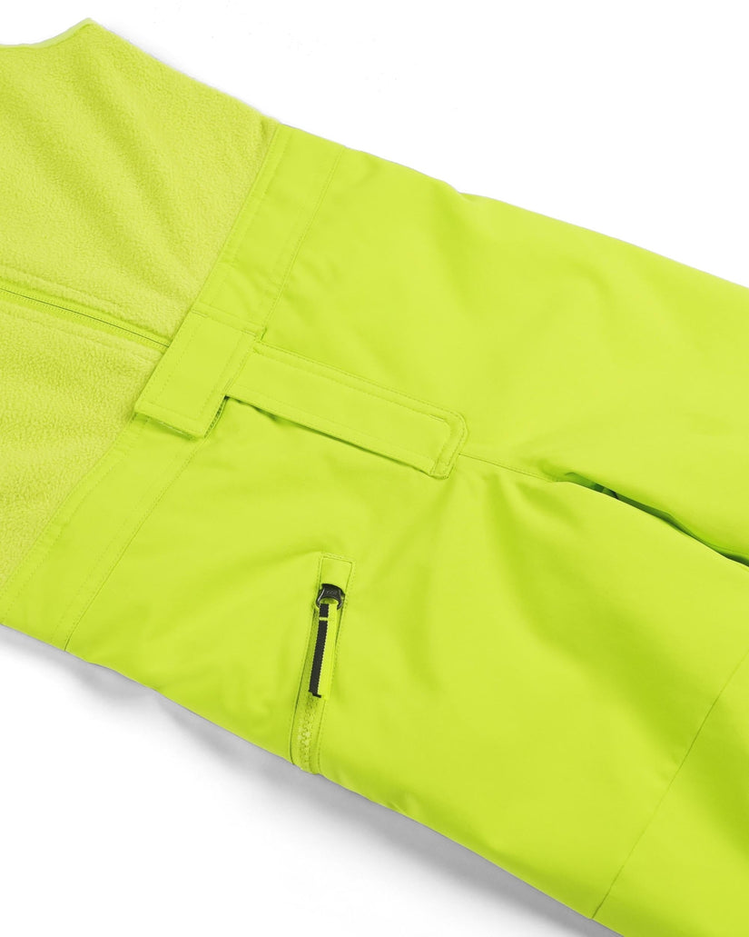 Close-up of bright green pants with a pocket and zipper on a white background