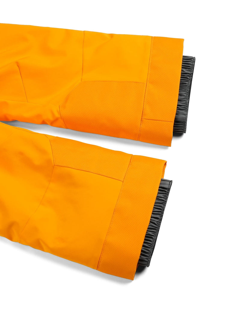 Two orange broom handles with black bristles on a white background