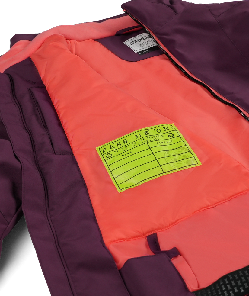 Inside of a purple jacket with a Pass Me On label